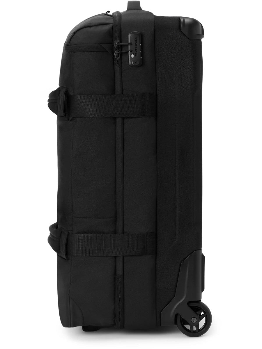 Dakine Split Roller Bag 2.0 85L in Black, side view showing the grab handles, compression straps, combination lock and wheels