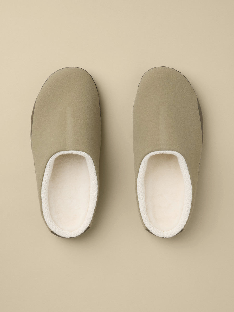 Arcteryx PostTour in Tatsu/Black, overhead view of the pair of beige inner liner slippers with cream fleece lining