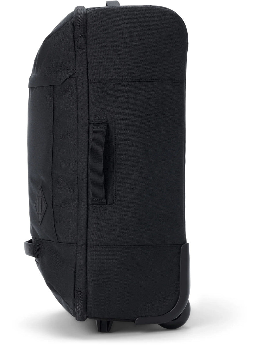 Dakine 365 Carry-On Roller Bag LT 40L in Black, side view showing the padded grab handle, slim profile and wheel housing