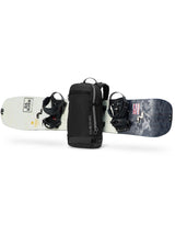 Dakine Heli 2.0 Pro Pack 20L in Black with a snowboard strapped horizontally across the front panel, side view