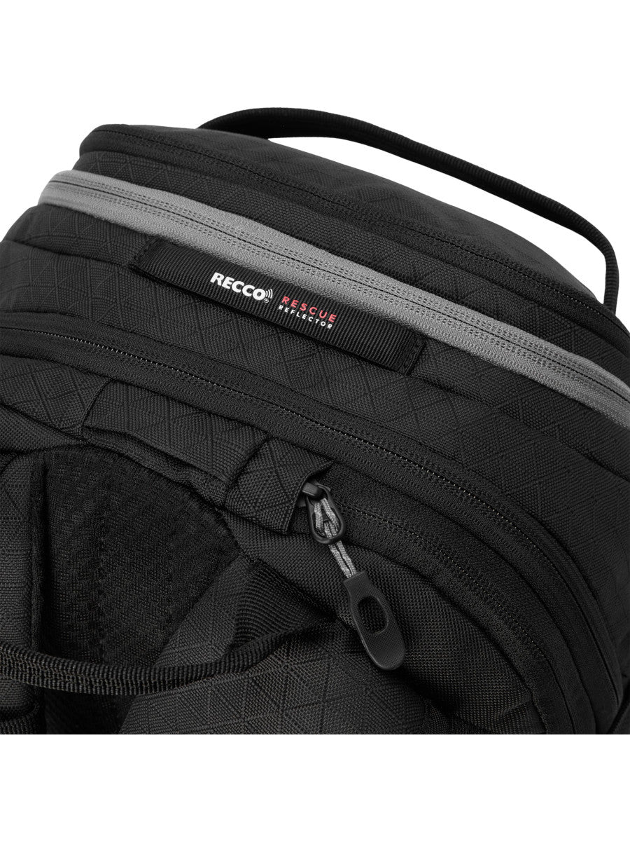 Close-up of the Dakine Heli 2.0 Pro Pack 20L in Black showing the top grab handle, RECCO label and zipped top pocket