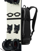 Dakine Heli 2.0 Pro Pack 26L in Black carrying a splitboard vertically on the front panel, side view