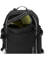 Close-up of the Dakine Heli 2.0 Pro Pack 26L in Black showing a ski goggle stowed in the unzipped top pocket