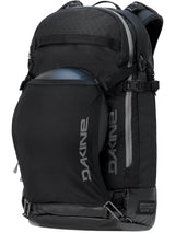 Dakine Heli 2.0 Pro Pack 26L in Black with a helmet held in the stretch front carrier, three-quarter view